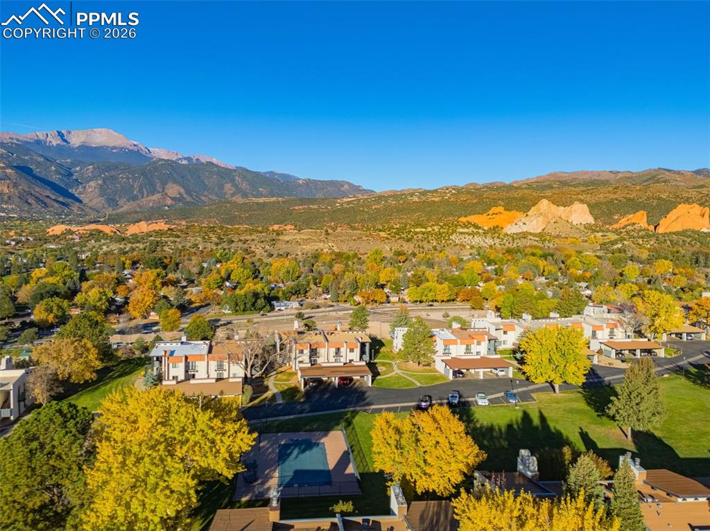 Image 31 of 33: Aerial view of residential area featuring mountains