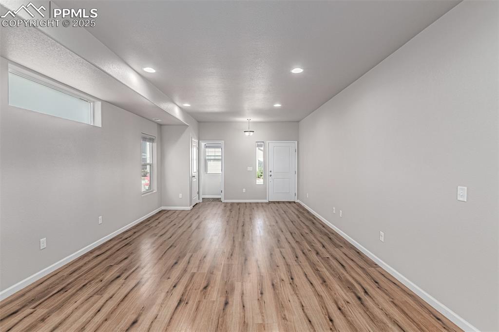 Image 4 of 29: Foyer entrance featuring light wood-style floors and recessed lighting