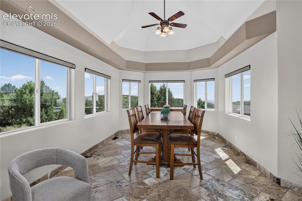 Image 10 of 37: Adjacent sunroom with city views