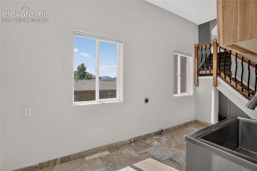 Image 15 of 37: Large laundry space (14x8) w/ both gas & electric hook-ups