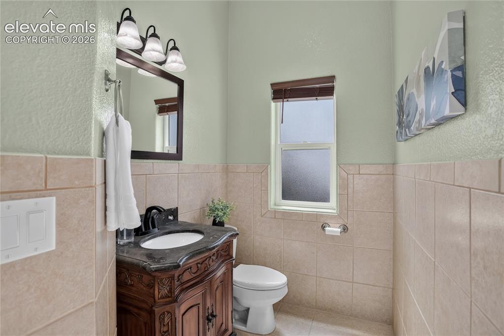 Image 16 of 37: Main level powder room