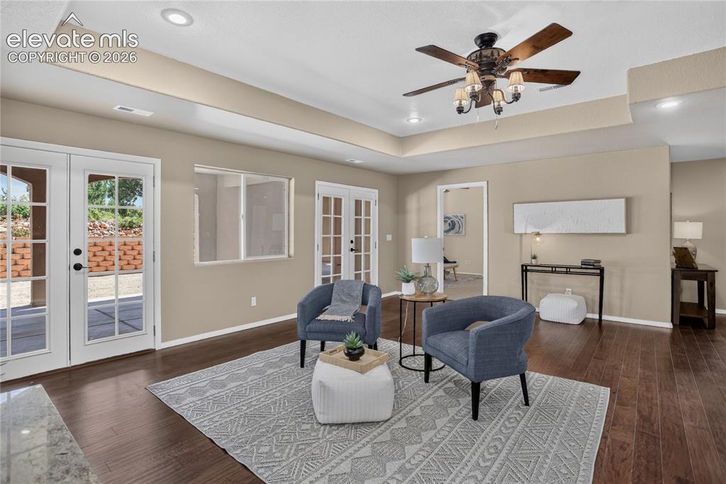 Image 22 of 37: Great entertainment space w/ dual walk-out to covered patio