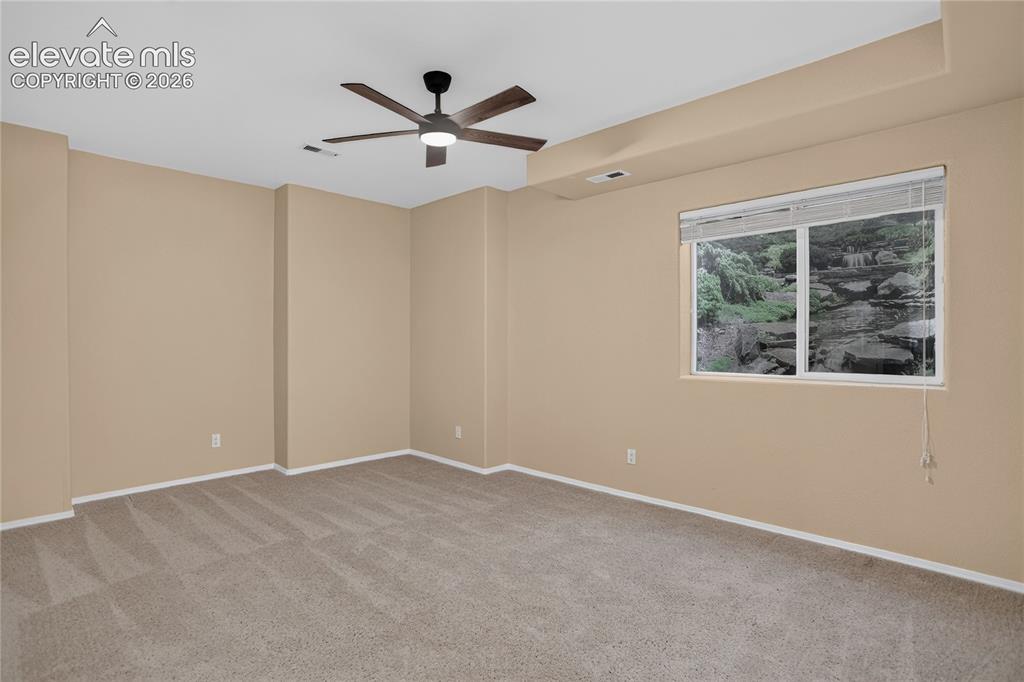 Image 30 of 37: Bedroom 5 w/ huge walk-in closet - lower level