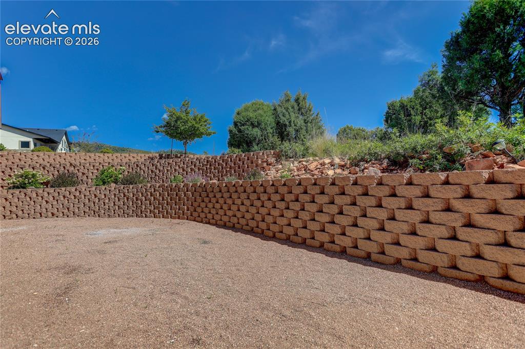 Image 33 of 37: Terraced backyard with easy maintenance plants