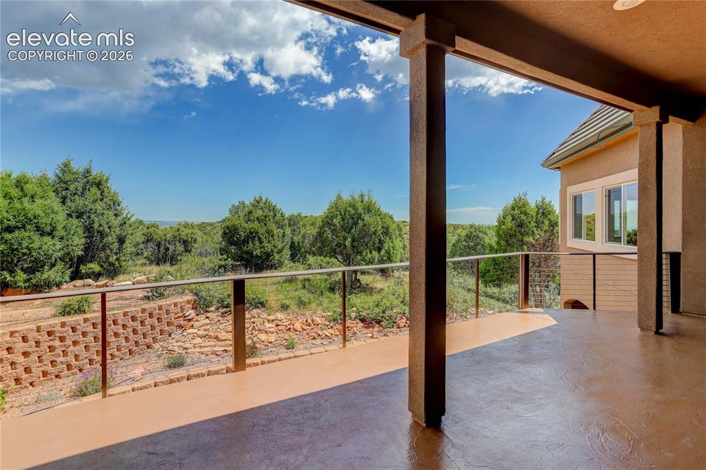 Image 7 of 37: Main level, covered deck with views east over the city
