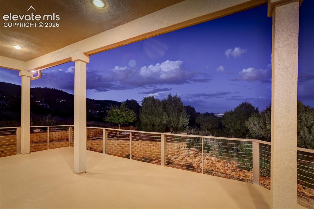 Image 7 of 41: Main level, covered deck with views east over the city