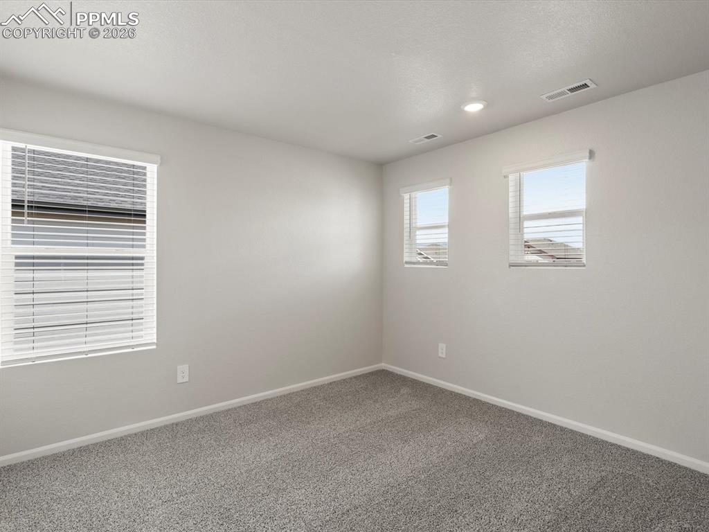 Image 19 of 30: Spare room featuring carpet and recessed lighting