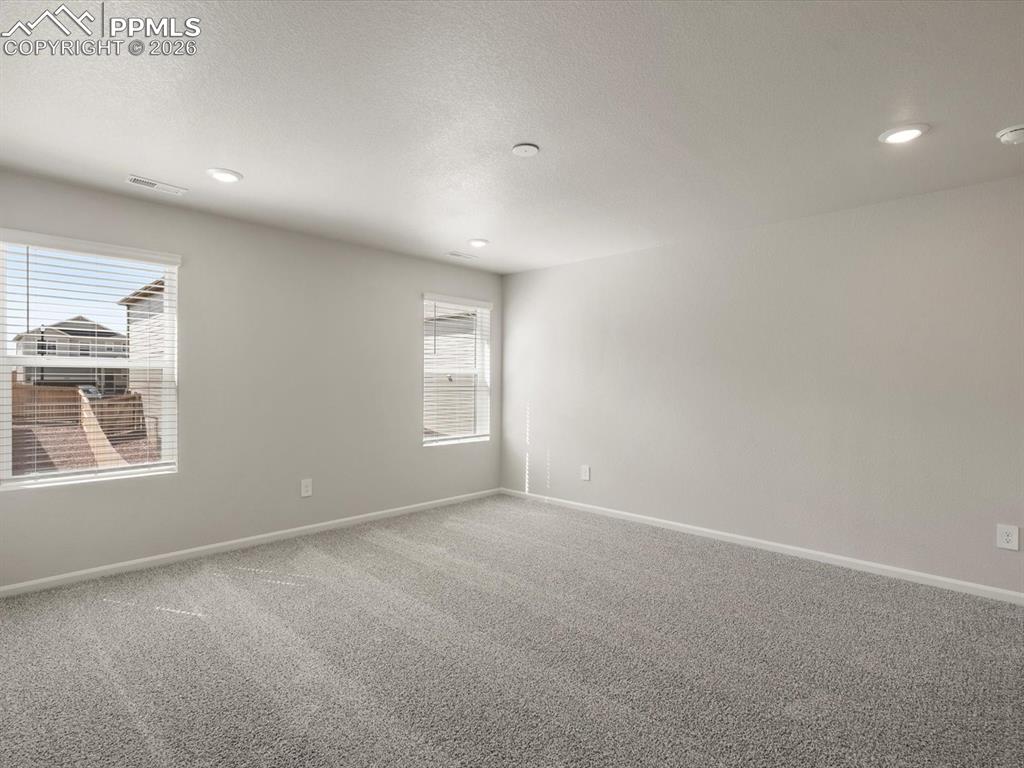Image 23 of 30: Carpeted empty room featuring recessed lighting and a textured ceiling