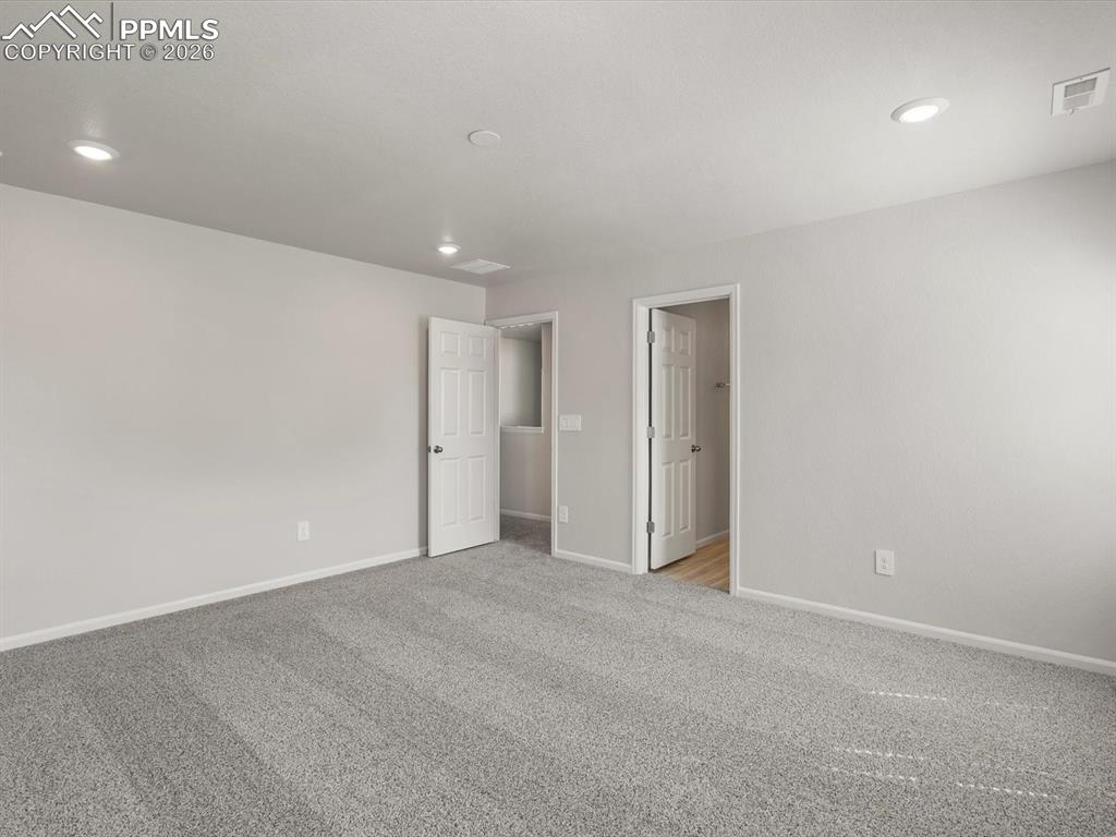 Image 24 of 30: Unfurnished bedroom featuring carpet flooring and recessed lighting