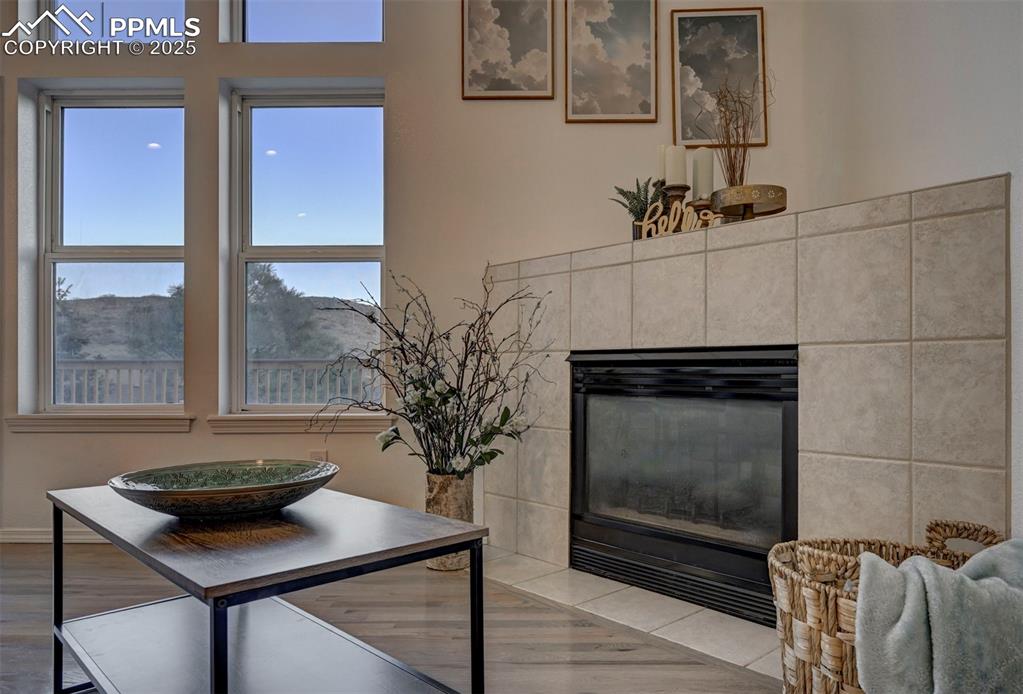 Image 11 of 50: Cozy up to the gas fireplace with tile surround on chilly Colorado nights.