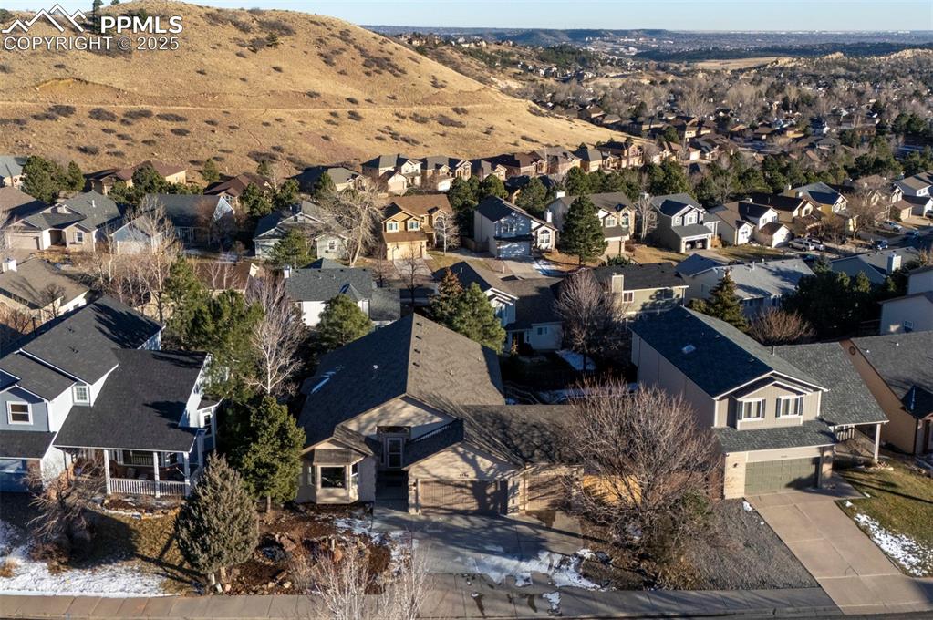 Image 2 of 50: Aerial view of home, city and mountain views.