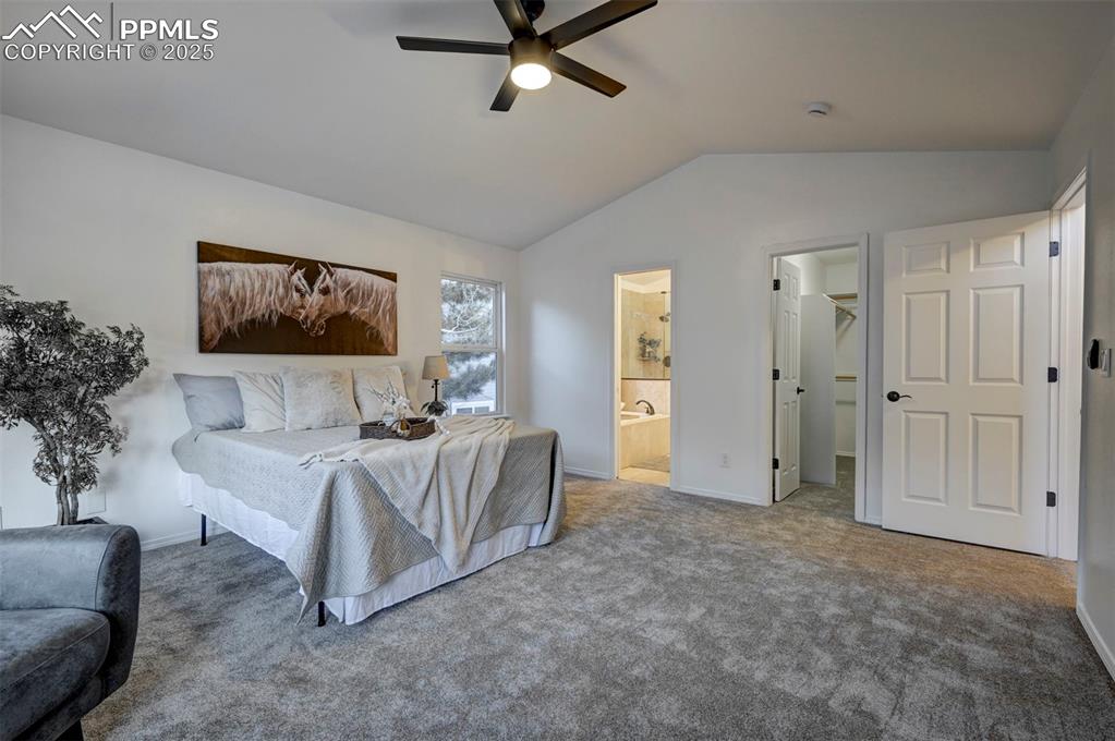 Image 29 of 50: The Main Level Primary Suite is a private retreat with walk-in closet and a