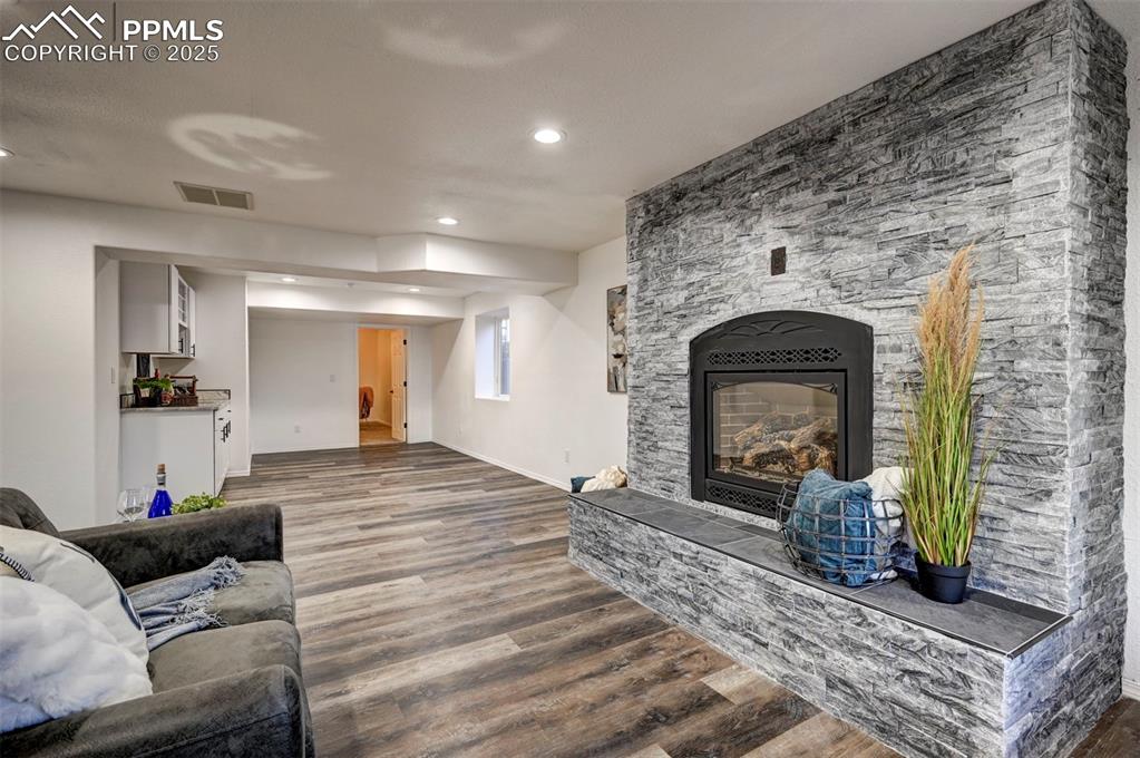 Image 36 of 50: Family Room with flex space for gaming or dining area and wet bar.