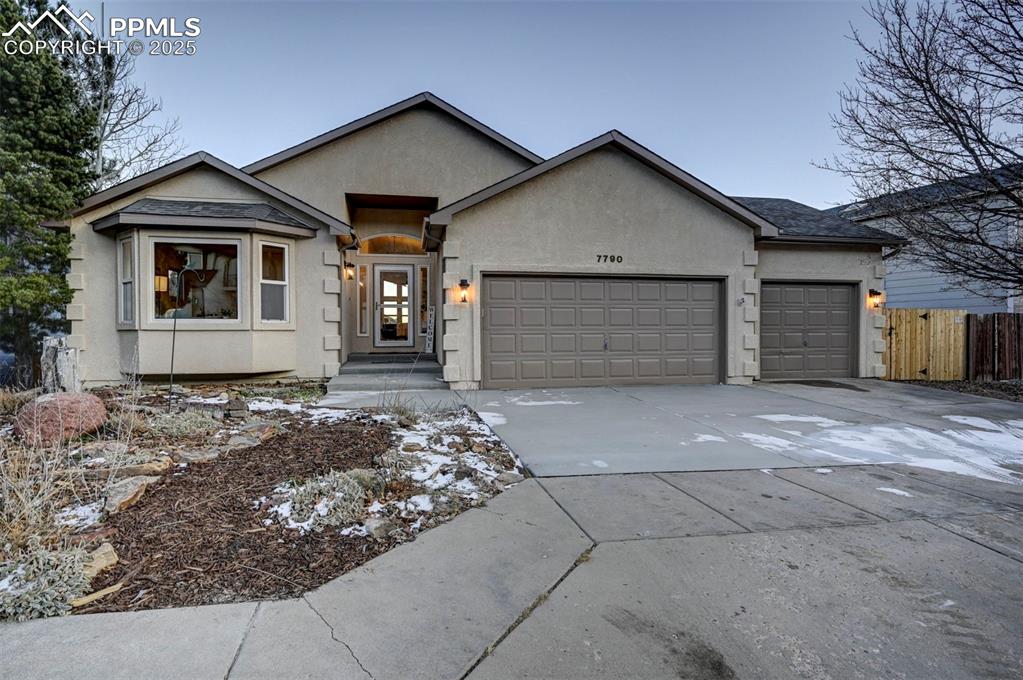 Image 4 of 50: Upgraded front yard landscaping and new concrete walk walkway and driveway