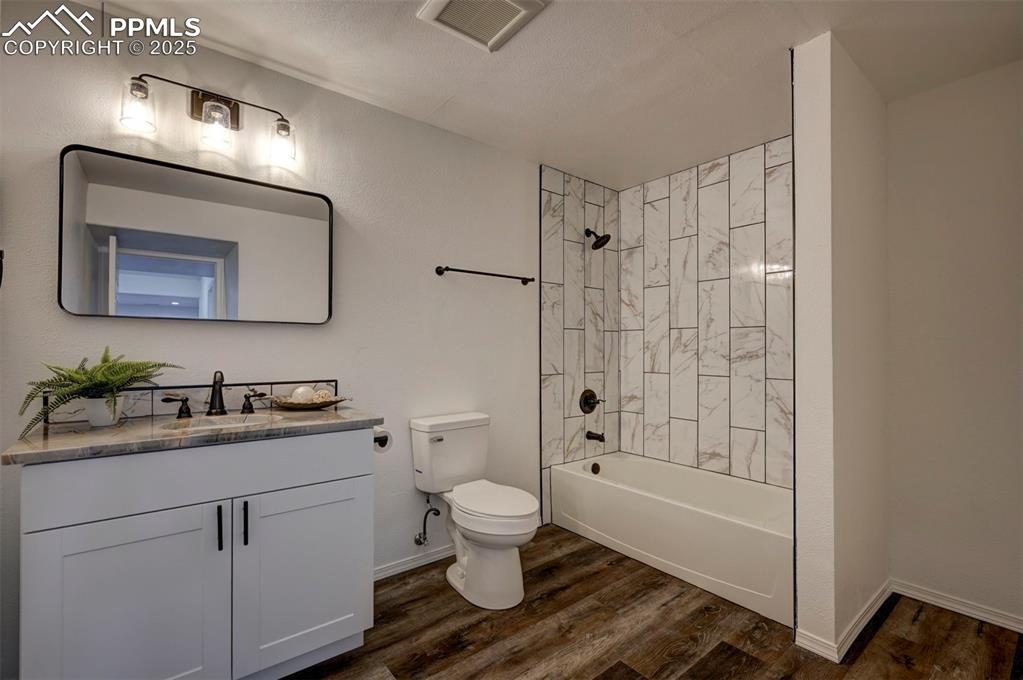 Image 45 of 50: Spacious Basement Full Bathroom with LVP floor, vanity with quartz countert