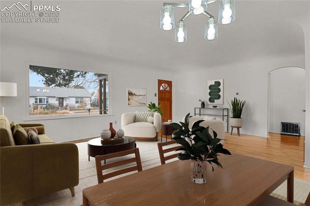 Image 11 of 29: New dining room light. Virtually Staged