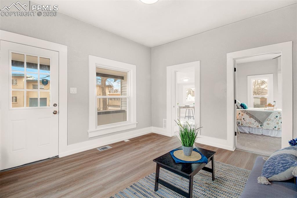 Image 2 of 24: Bright an open main living area with LVP flooring