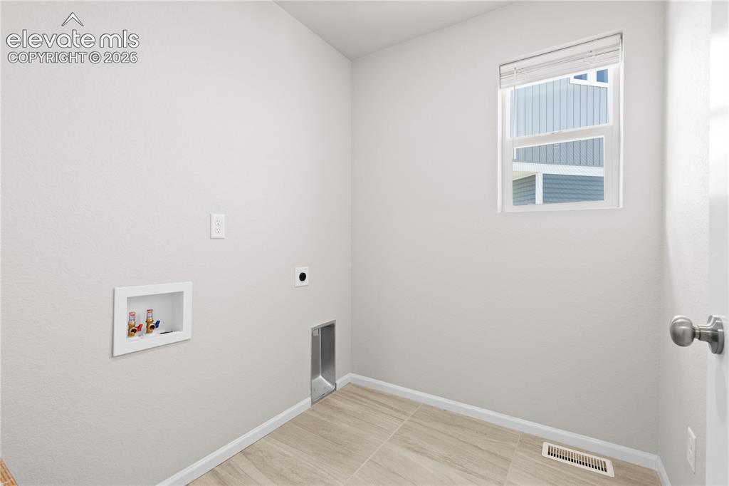 Image 11 of 26: Upstairs Laundry Room