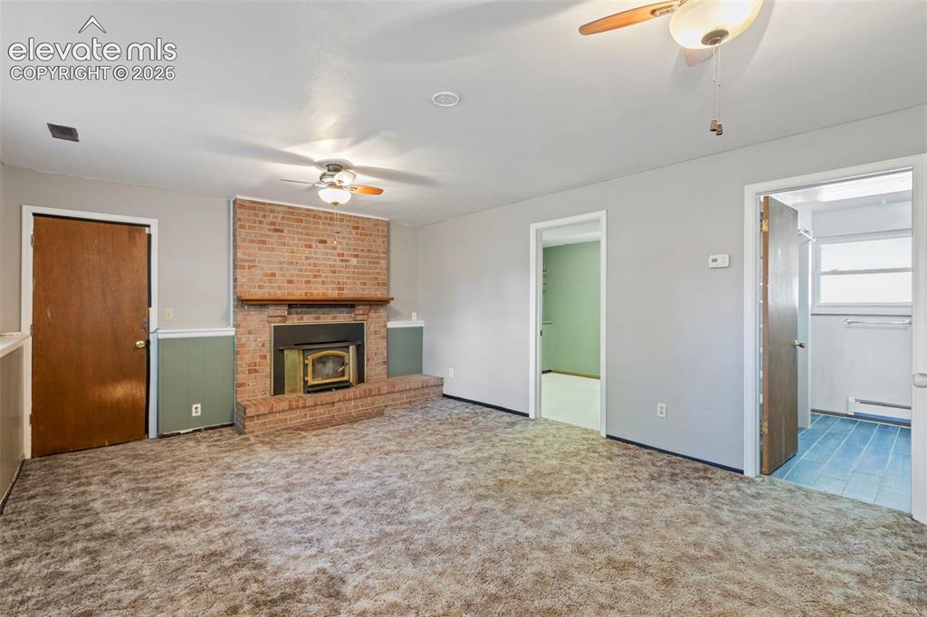 Image 19 of 25: Lower Level wood burning stove exit to garage