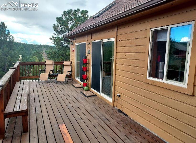 Image 4 of 16: Front of House with deck