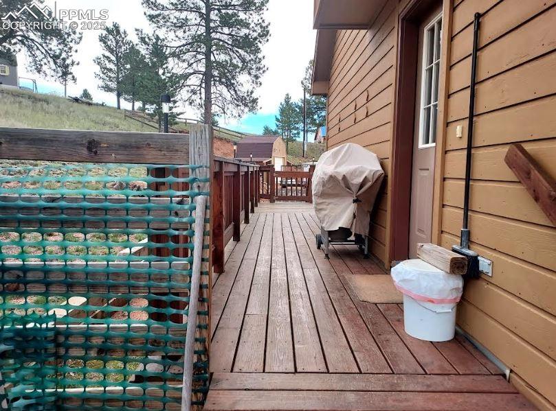 Image 5 of 16: Side of house with Deck
