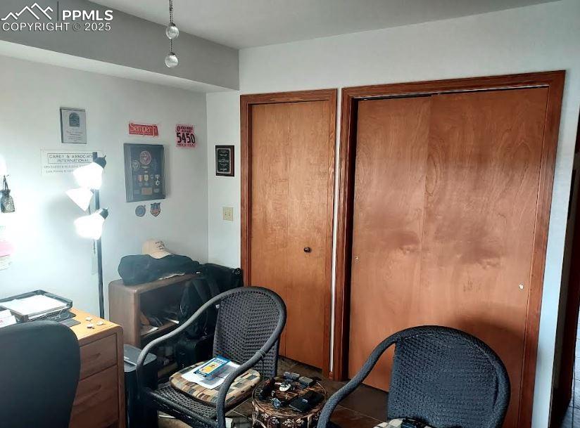 Image 9 of 16: Main Floor Bedroom used as an office