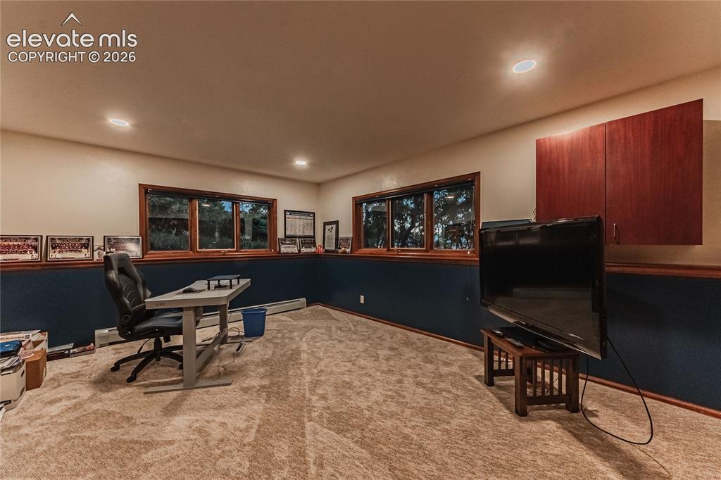 Image 32 of 43: Office area featuring carpet floors