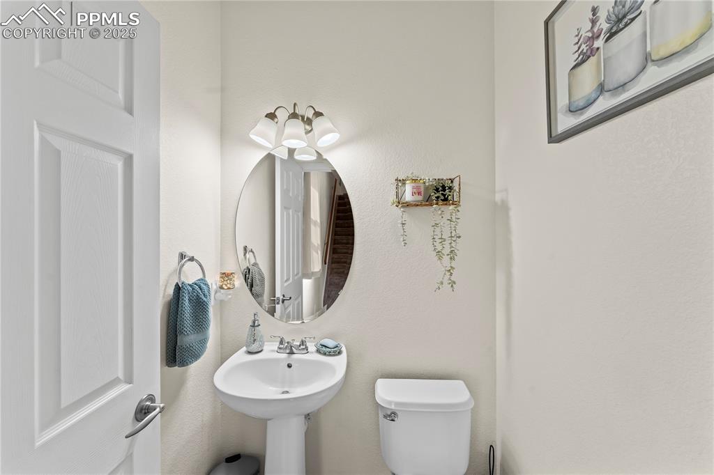 Image 13 of 25: Bathroom featuring a textured wall