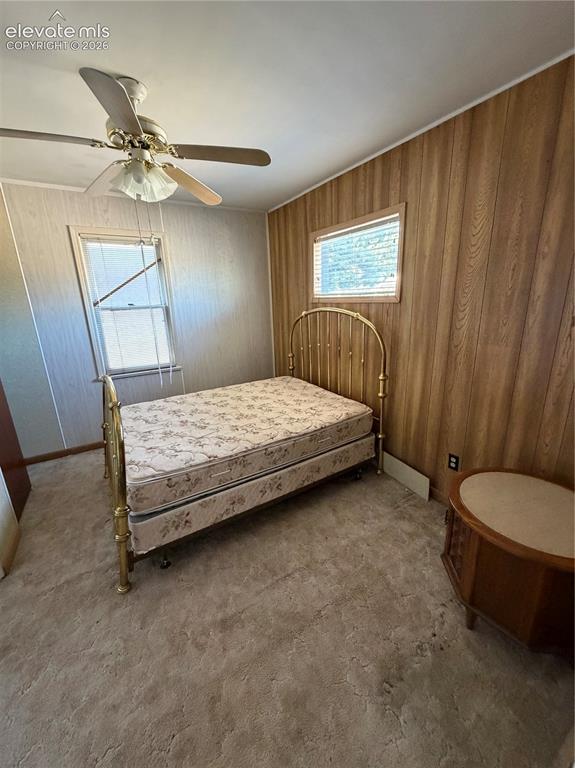 Image 13 of 28: Vanity with integrated sink, shower stall with sliding glass door, and a fi