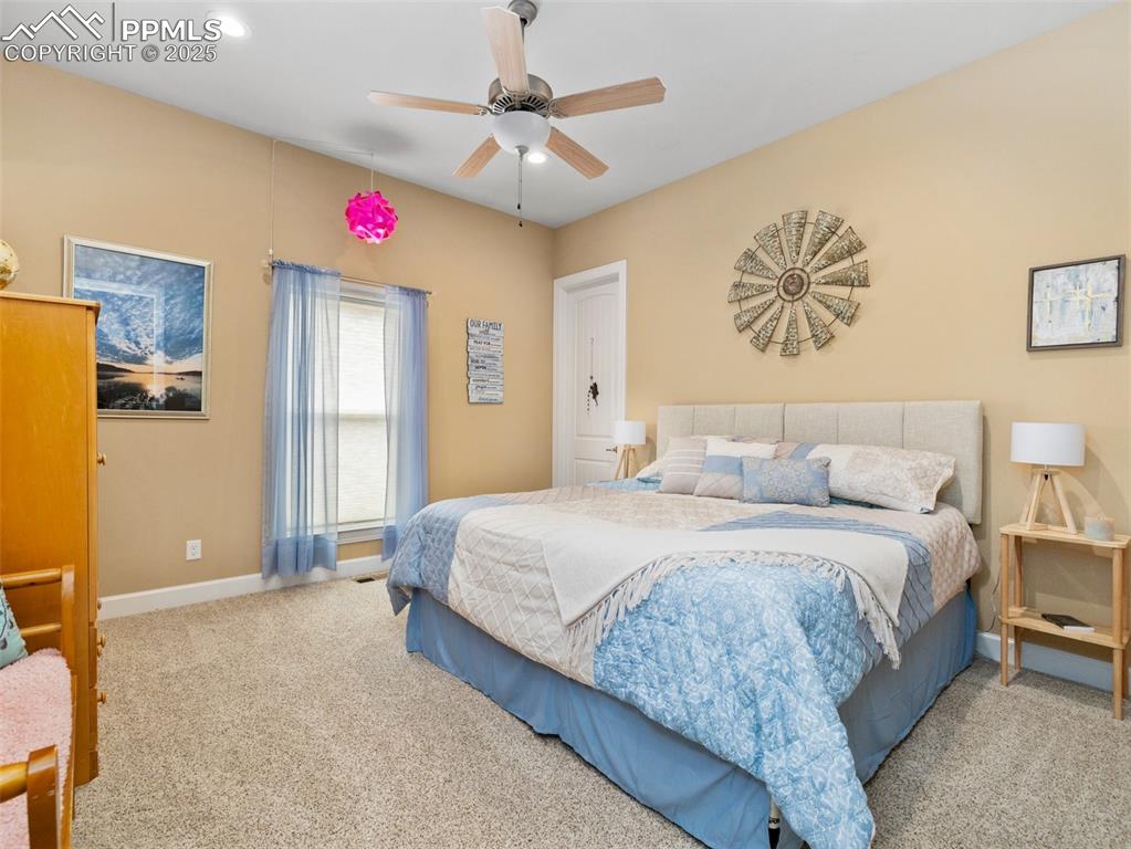 Image 26 of 46: Carpeted bedroom with a ceiling fan, recessed lighting, and baseboards