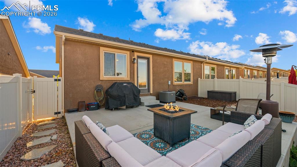 Image 25 of 27: Private patio, concrete surfacing, and a direct entrance to the interior