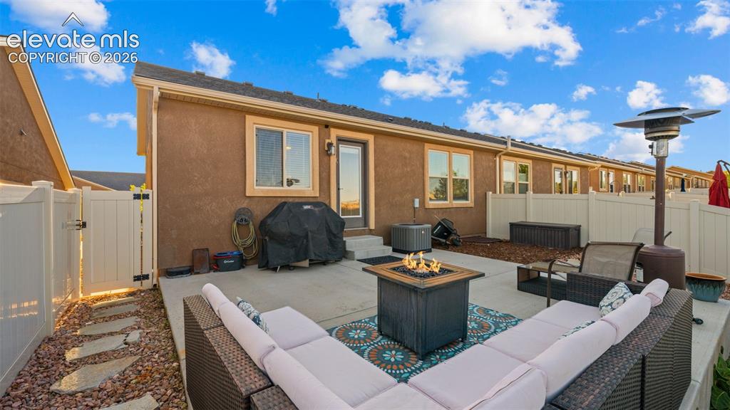 Image 26 of 27: Private patio, concrete surfacing, and a direct entrance to the interior