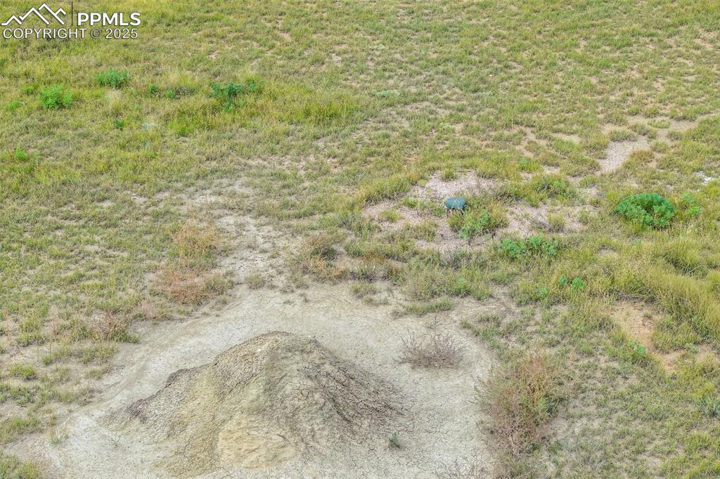 Image 13 of 17: Dirt pile near well head