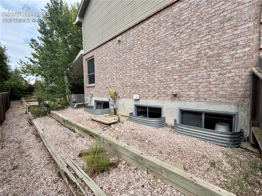 Image 13 of 49: Brick exterior with a concrete foundation