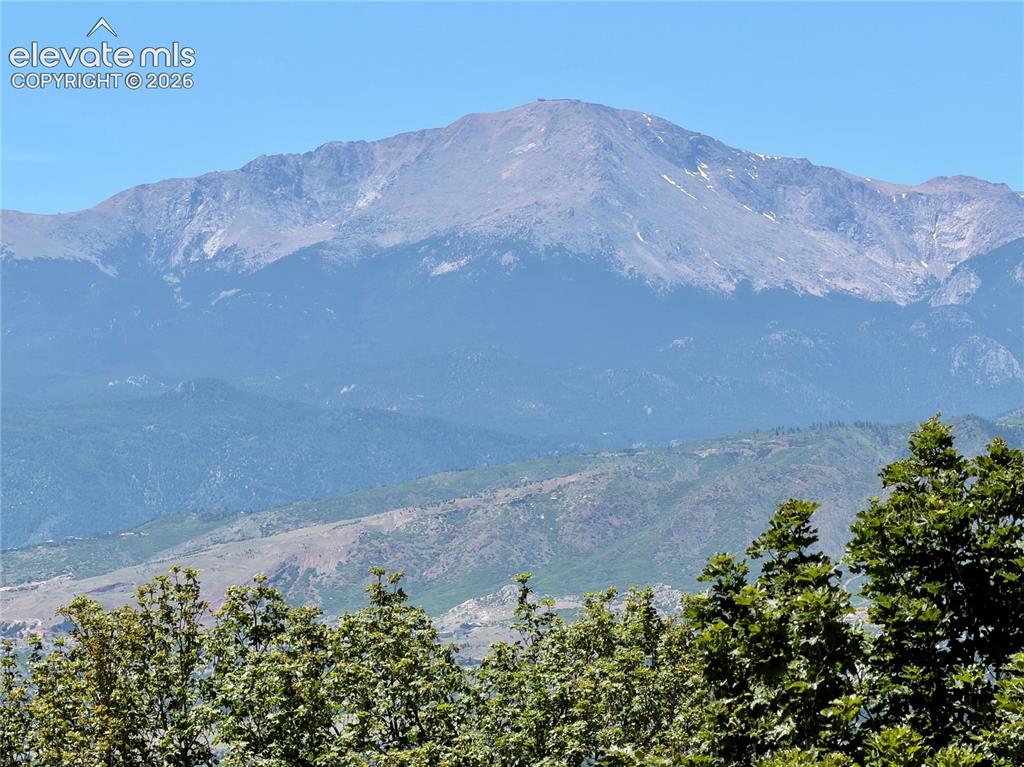 Image 2 of 49: Pikes Peak from upstairs bedroom. Zoomed in