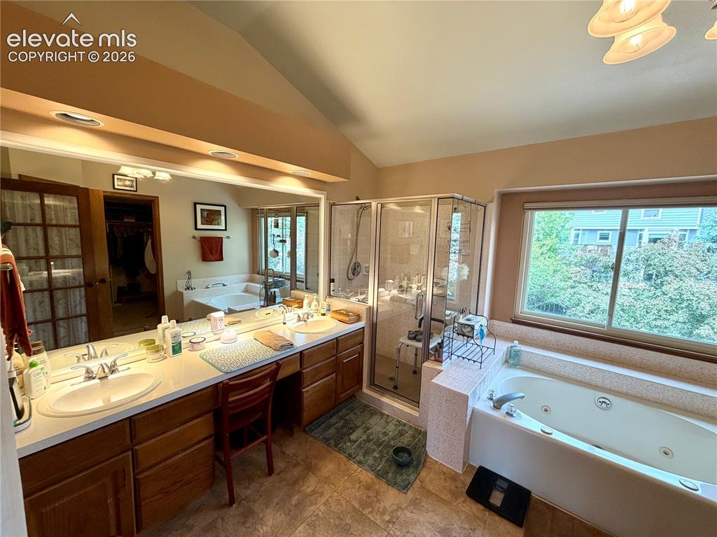 Image 29 of 49: Spacious bathroom featuring a double vanity with ample counter space, a lar