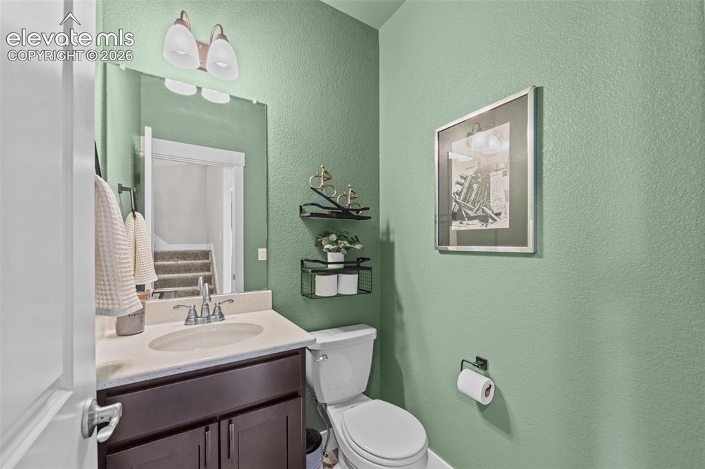 Image 14 of 46: Main level half bath