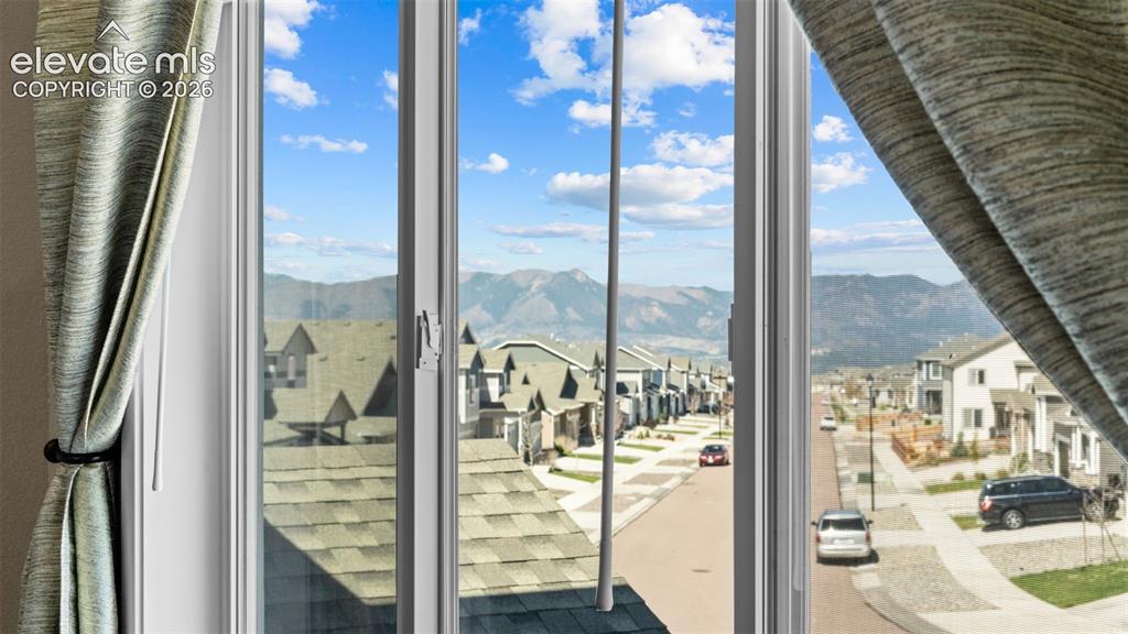 Image 16 of 46: Mountain Views from Primary Bedroom