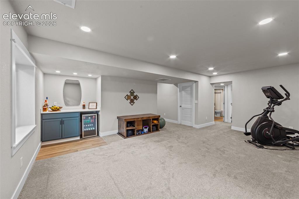 Image 29 of 46: Huge Family ROom with dry bad built in with a mini fridge