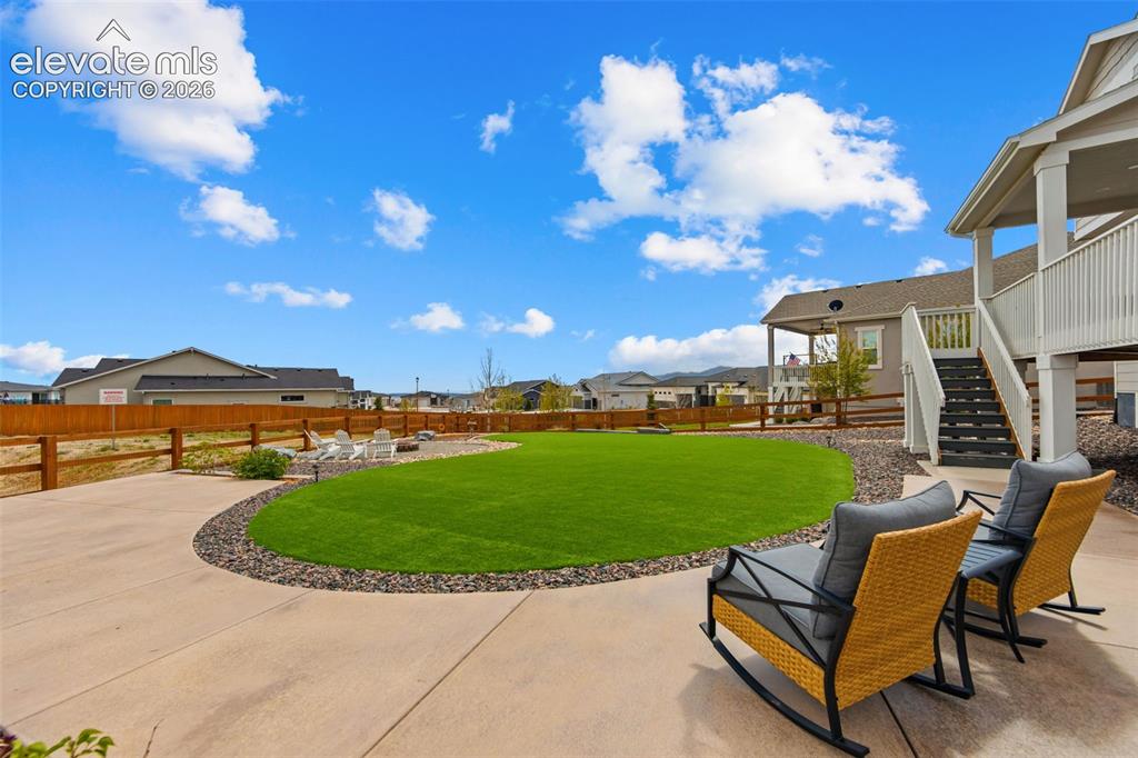 Image 38 of 46: Custom landscaping makes this yard easy to care for and usable all year rou