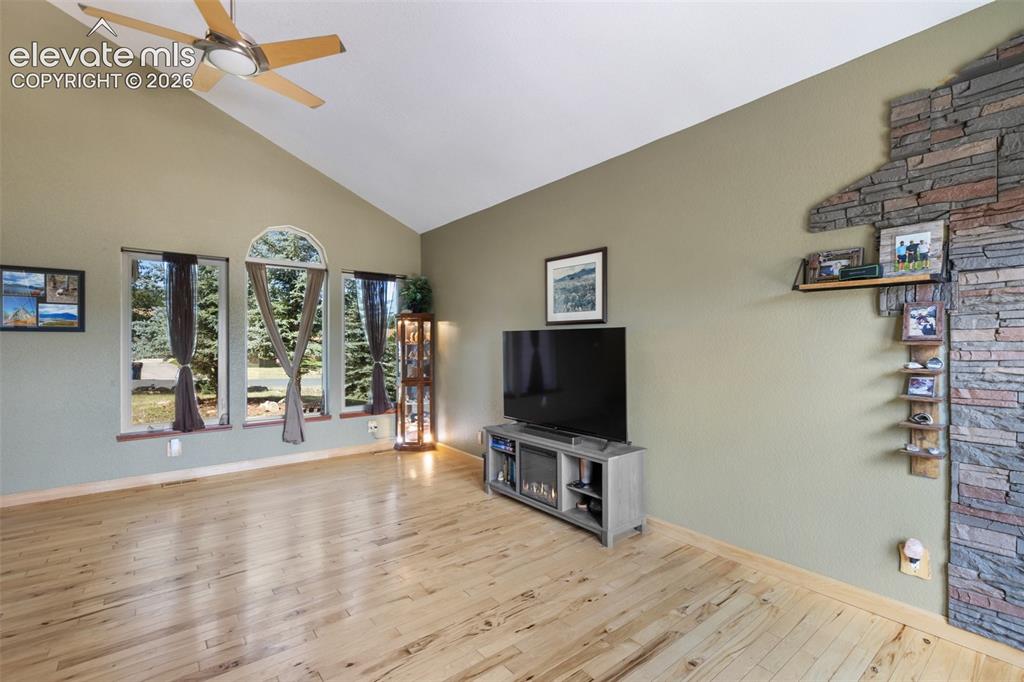 Image 6 of 36: Living room with vaulted ceilings!