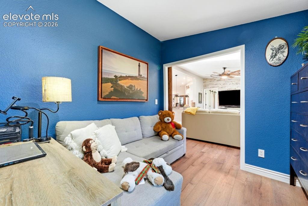 Image 38 of 50: Wood-finish flooring throughout, can be an office or 3rd bedroom