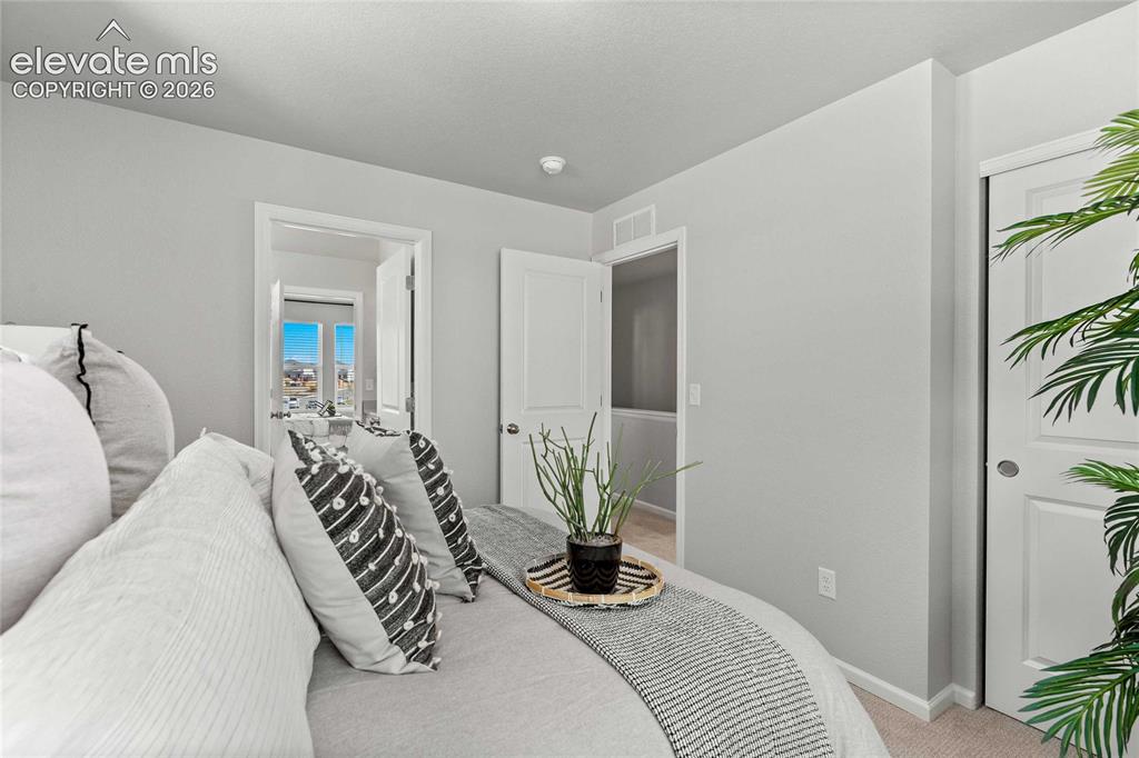 Image 23 of 25: Neutral wall tones, recessed lighting, and light-colored carpeting
*photos