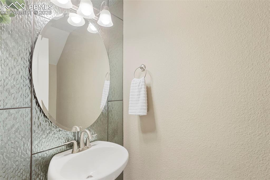 Image 22 of 45: Powder room on the main level