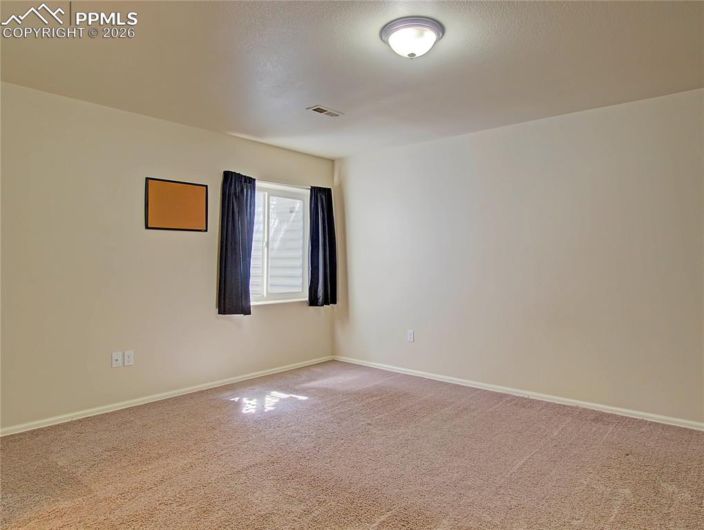Image 23 of 27: Basement front bedroom