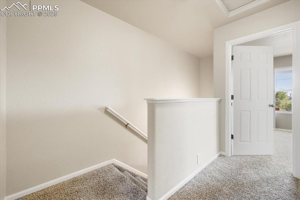 Image 19 of 42: Staircase featuring carpet and baseboards