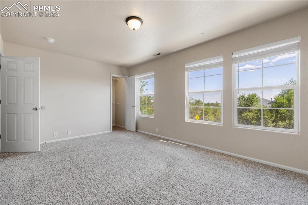 Image 21 of 42: Unfurnished bedroom featuring baseboards and carpet