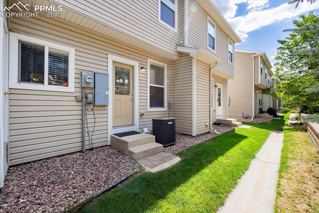 Image 35 of 42: Entrance to property with a yard