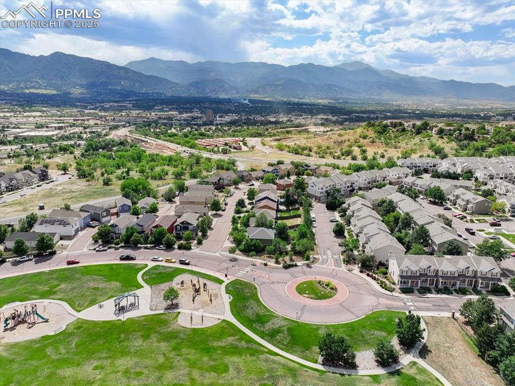 Image 41 of 42: Aerial view of residential area featuring mountains