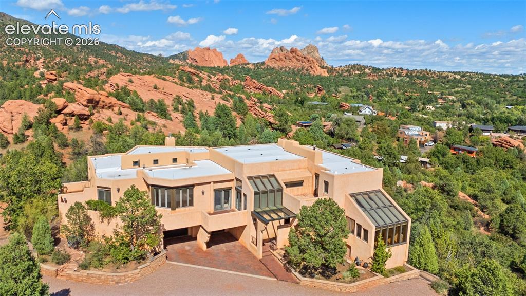 Caption: A remarkable setting at the top of Via Linda Vista, where the home is surrounded by sweeping views o